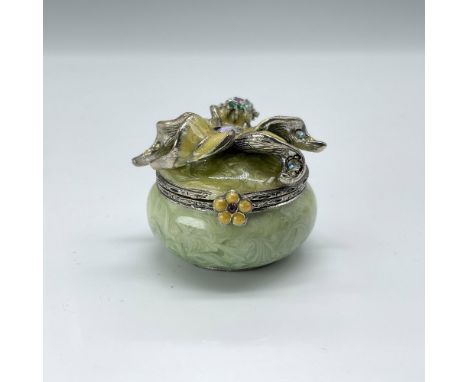 This is a tiny round light green box with long yellow colored flower blossom on top. This item has its original box which mea