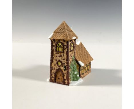 This cozy miniature is a Dickens' Village Ornament collectible by Department 56. Along with its moss covered walls, it contai