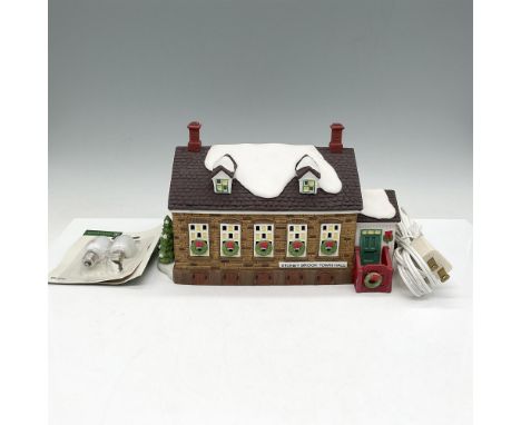 Part of the New England Village Series, building is decorated for the holidays with wreaths on windows and doors. Hall lights