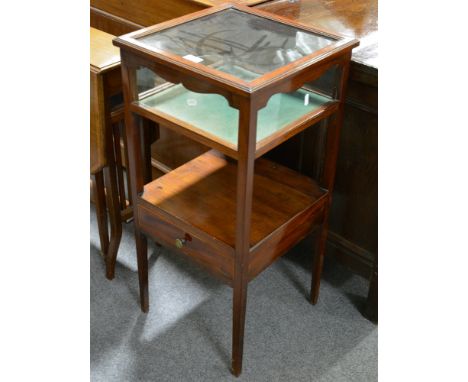 Edwardian mahogany bijouterie cabinet, the tapering legs joined by a shelf with a drawer, 37x37cm, height 78cm.