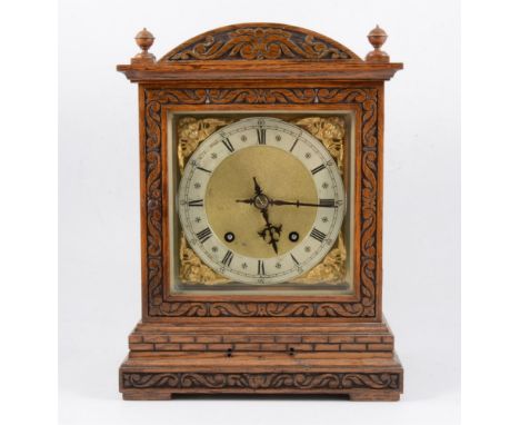 Edwardian oak mantel clock, domed case with carved decoration, square dial with silvered chapter ring, cast seraphim spandrel