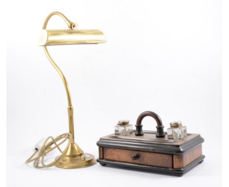 Brass desk lamp, 42cm, a walnut and ebonised desk stand and two small stoneware bottles.