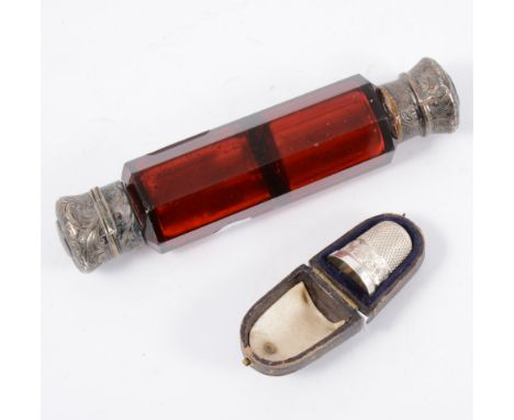A Charles Horner silver thimble, Chester 1895 (cased) and a ruby glass double ended perfume bottle.
