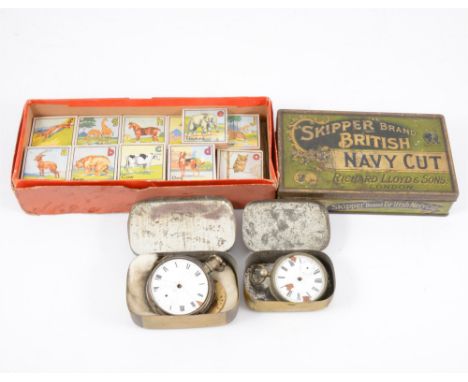 Collection of vintage tins, two incomplete pocket watches and a set of alphabet bricks.