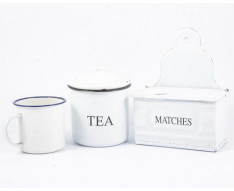 A collection of vintage enamel kitchenalia, in a Jaffa citrus board crate, including a Kemps biscuit tin.