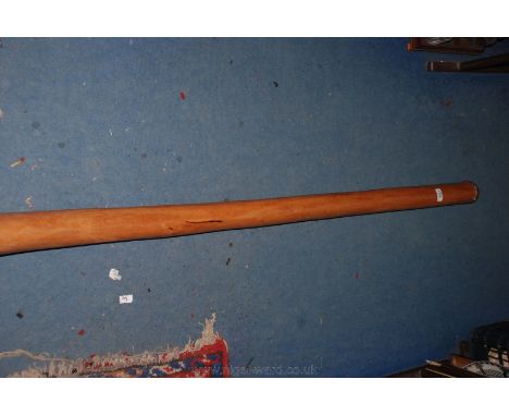 A wooden Didgeridoo from Australia.