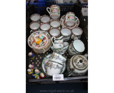 A quantity of oriental china including a Teaset for four, cups and saucers and a quantity of figures.