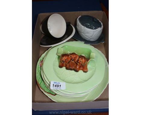 A quantity of Carltonware including brown cup and saucer, sauce pot with stand, floral plates and a Beswick dish with three d