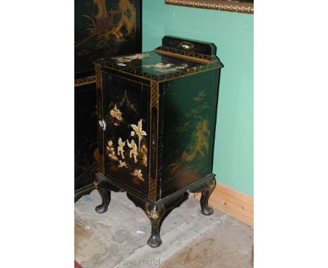 A circa 1900 Chinoiserie lacquered Pot Cupboard having upstand back on moulded edge square top, over single panel door, on lo