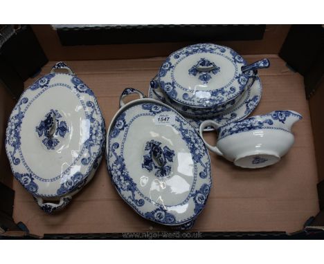 Two blue and white lidded vegetable Dishes, sauce tureen, gravy boat and ladle.