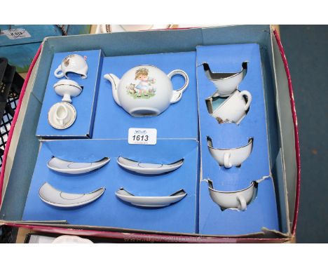 A Child's Teaset for four including cups, saucers, teapot, milk jug and sugar bowl, boxed