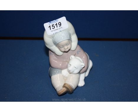 A Lladro figure of a Polar Bear and an Eskimo.