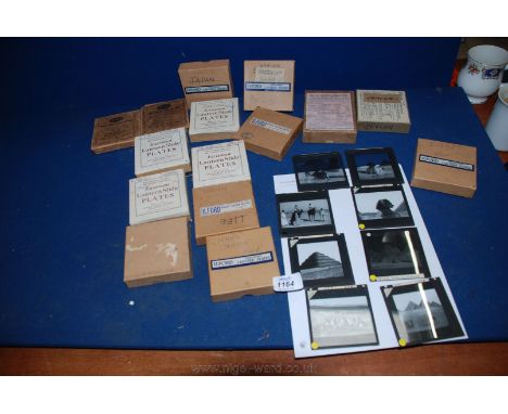 Fourteen boxes of various glass Lantern Slides.