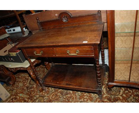 A late 19th c. Oak Buffet having ball finial mounted upstand back with central arched feature with carved floral motif, the m
