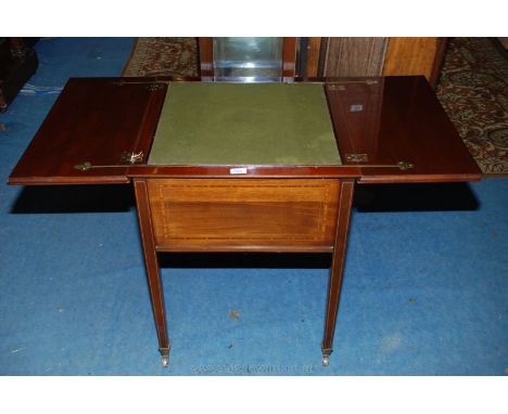 A superb Edwardian Mahogany patent action Games Table, having twin leaf cross-banded moulded edge top, both leaves folding ou