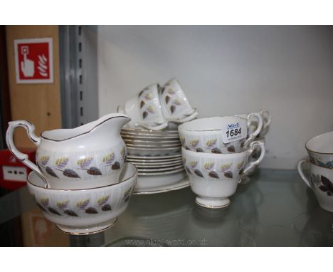 A Paragon bone china Teaset including bread and butter plate, six tea plates, six cups and saucers, milk jug and sugar bowl.
