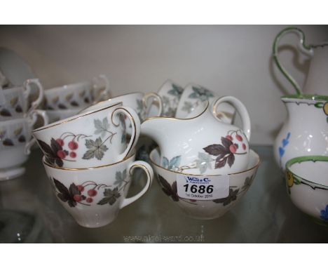 A Royal Worcester six piece Coffee Set with milk jug and sugar bowl in Camelot pattern.