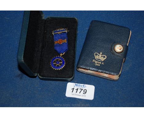 A Silver and Enamel Rotary Medal and a small 1953 English Dictionary