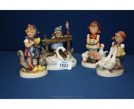Four Goebel ''Hummel'' figures including 'Feeding Time', 'Feathered Friends', girl feeding ducks and girl with two geese.