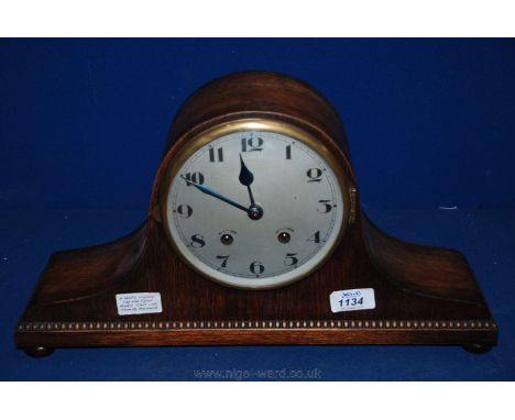 A 1920's Napoleon Hat Oak Cased Mantle  Clock with Chiming Movement.
