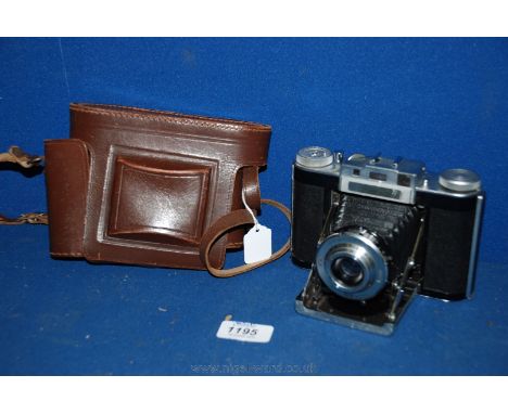 An Agilux Agifold English made folding bellows Camera having 75mm f/4.5 Lens with original ever ready case