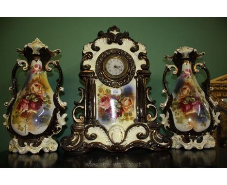 A Victorian china Garniture of mantle Clock and pair of Vases.