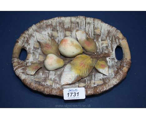 An Austrian ceramic Wall Plaque decorated with a branch of pears.