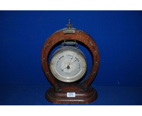 An old wooden horseshoe surround with hanging Barometer by Hall & Co., 50 King St, Manchester.