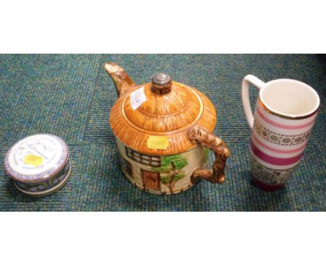 A Beswick ware teapot, millennium pot and lid, and a Whittard mug.