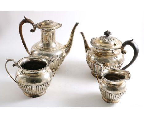 A LATE VICTORIAN FOUR-PIECE TEA &amp; COFFEE SERVICE with part-fluted circular bodies and gadroon &amp; foliate shell borders