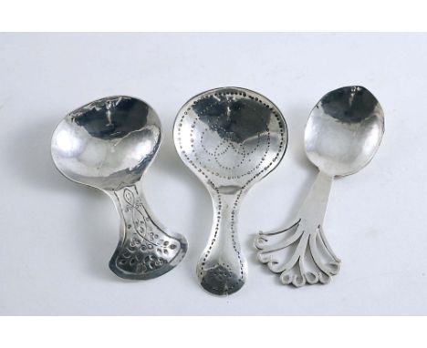 THREE HANDMADE CADDY SPOONS:- One with punched decoration in the bowl &amp; up the stem by Messrs. Pairpoint, London 1922, an