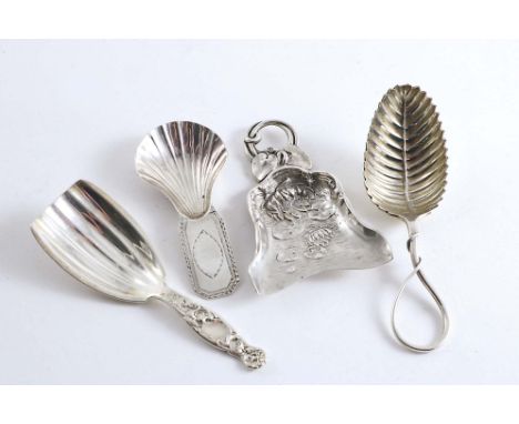NORTH AMERICA:- An Art Nouveau caddy scoop, decorated to resemble a lily pond, maker's mark a monogram, c.1900, another with 