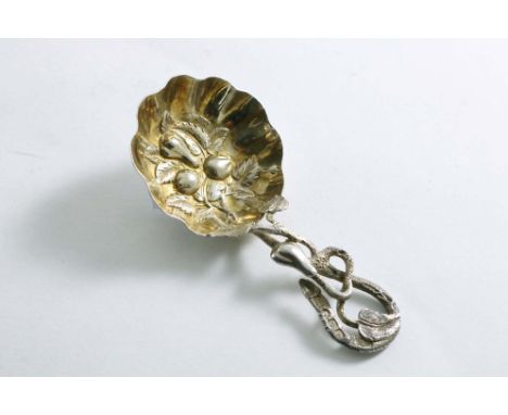 A VICTORIAN PARCELGILT CADDY SPOON with a naturalistic fruiting stem and embossed fruit in the bowl, by Hilliard &amp; Thomas