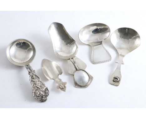 A CONTEMPORARY CAST CADDY SPOON richly decorated with vines &amp; vine leaves, plain bowl interior, by the Marlow Brothers, L