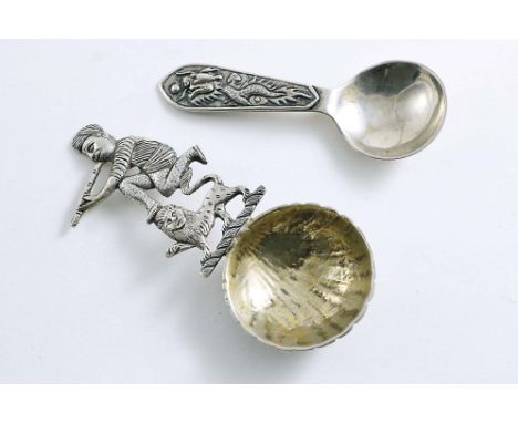CHINESE &amp; INDIAN:- A late 19th / early 20th century Indian caddy spoon with a chased &amp; fluted shell bowl, the stem in