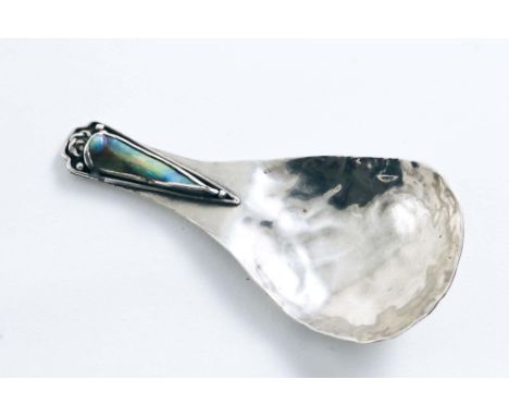 A RARE SCOTTISH HANDMADE CADDY SPOON decorated along the stem with wirework and inset with a triangular piece of abalone shel