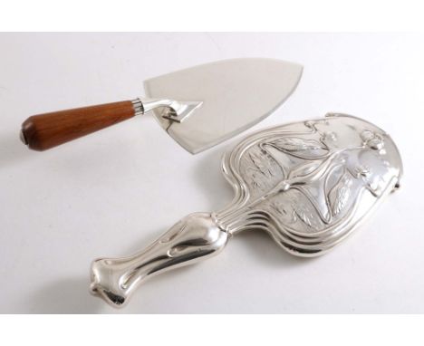 AN EDWARDIAN ART NOUVEAU HAND MIRROR by W. Aitken, Birmingham 1908 and a presentation trowel with a wooden handle (not inscri