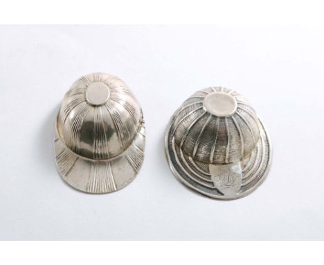 A GEORGE III "JOCKEY CAP" CADDY SPOON with alternate plain and reeded decoration radiating from a plain oval, central cartouc
