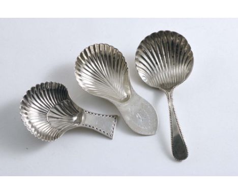 SHEFFIELD:- Three George III caddy spoons with fluted shell bowls to include a Bead pattern example, initialled "B", by Richa