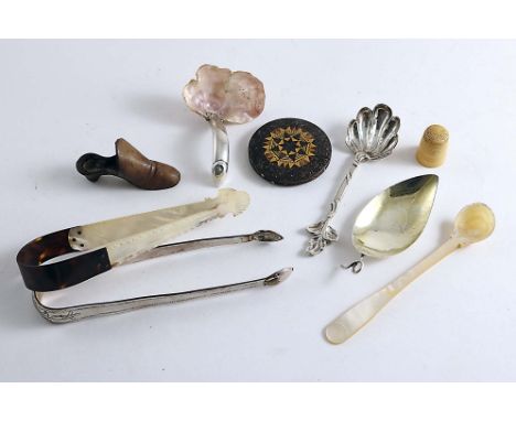 A MIXED LOT:- A George III caddy spoon with a gilt, leaf-shaped bowl, an early Victorian naturalistic salt spoon, a pair of m