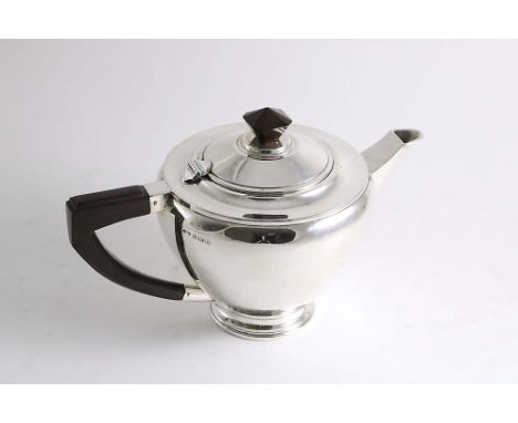 AN ART DECO REVIVAL TEA POT circular with an angular handle &amp; faceted knop finial, maker's mark mis-struck, Birmingham 19