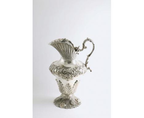 AN EARLY VICTORIAN IRISH LARGE EWER OR JUG in the form of a vase with an ivory-insulated foliate scroll handle, the body deco