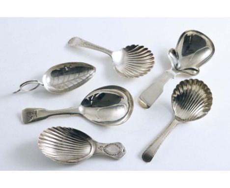 EXETER:- Six various caddy spoons to include a George III caddy spoon with a leaf bowl &amp; tendril handle, no maker's mark,