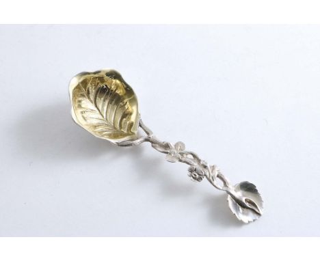 A VICTORIAN CAST NATURALISTIC CADDY SPOON with an openwork stem &amp; a deep, gilt, leaf-veined bowl, by Charles Thomas &amp;