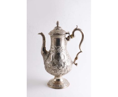 A GEORGE III IRISH PROVINCIAL COFFEE POT of baluster form with a domed, circular pedestal foot, a domed cover with bud finial
