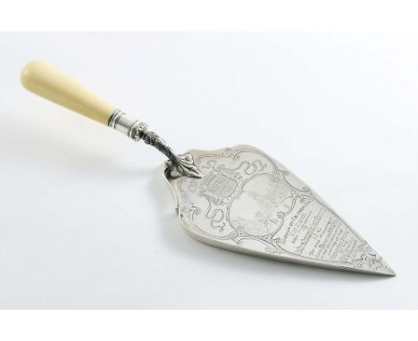 A LATE VICTORIAN PRESENTATION TROWEL with an ivory handle, engraved with the arms of Colchester and a view of town and inscri