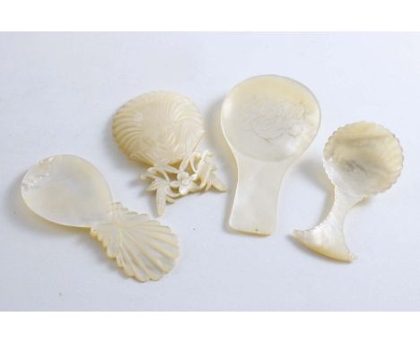 A PRIVATE COLLECTION OF CADDY SPOONS MOTHER OF PEARL:- A George III large plain example, initialled "TCR" in the bowl, a Geor