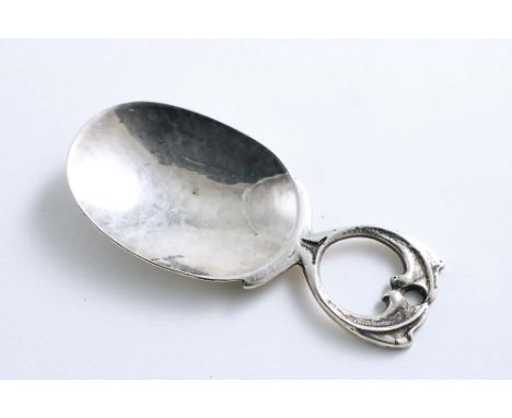 AN EDWARDIAN ARTS &amp; CRAFTS CADDY SPOON with a hammered finish and a cast, openwork handle, by A.E. Jones, Birmingham 1909