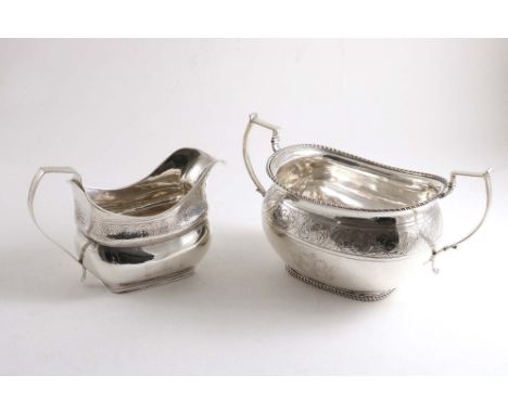 A GEORGE IV IRISH TWO-HANDLED SUGAR BASIN with an engraved frieze, a coat of arms, and a crest, by Edward Power, Dublin 1824 