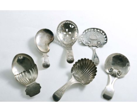SIX VARIOUS GEORGE III CADDY SPOONS:- One with a kidney-shaped bowl, one reticulated, one acorn-shaped, one with a canted ter